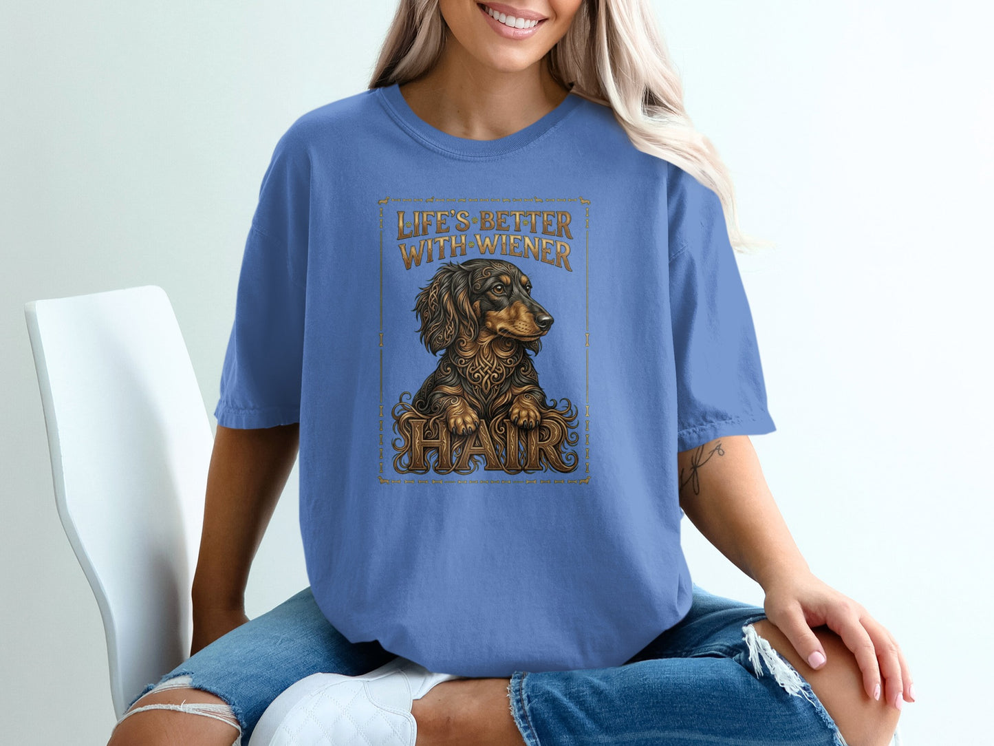 Blue t-shirt with dachshund graphic and text "Life's better with wiener hair."