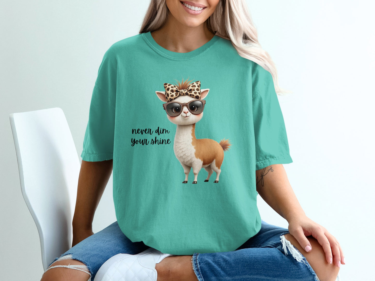 Teal t-shirt with a llama wearing sunglasses and a leopard print bandana.