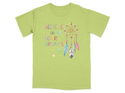 Green t-shirt with a dreamcatcher and "Believe in your dreams" text.