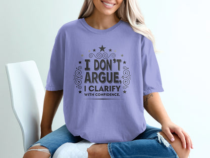 Purple t-shirt with "I DON'T ARGUE, I CLARIFY WITH CONFIDENCE" text.