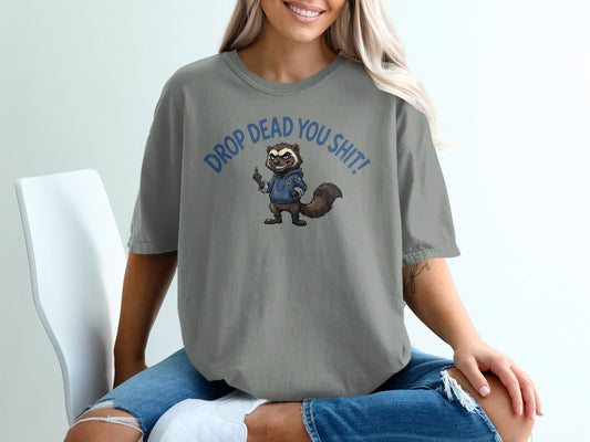 Gray t-shirt with raccoon graphic and "DROP DEAD YOU SHIT!" text.