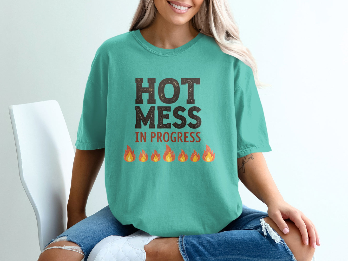 Teal t-shirt with "HOT MESS IN PROGRESS" and cartoon flames.