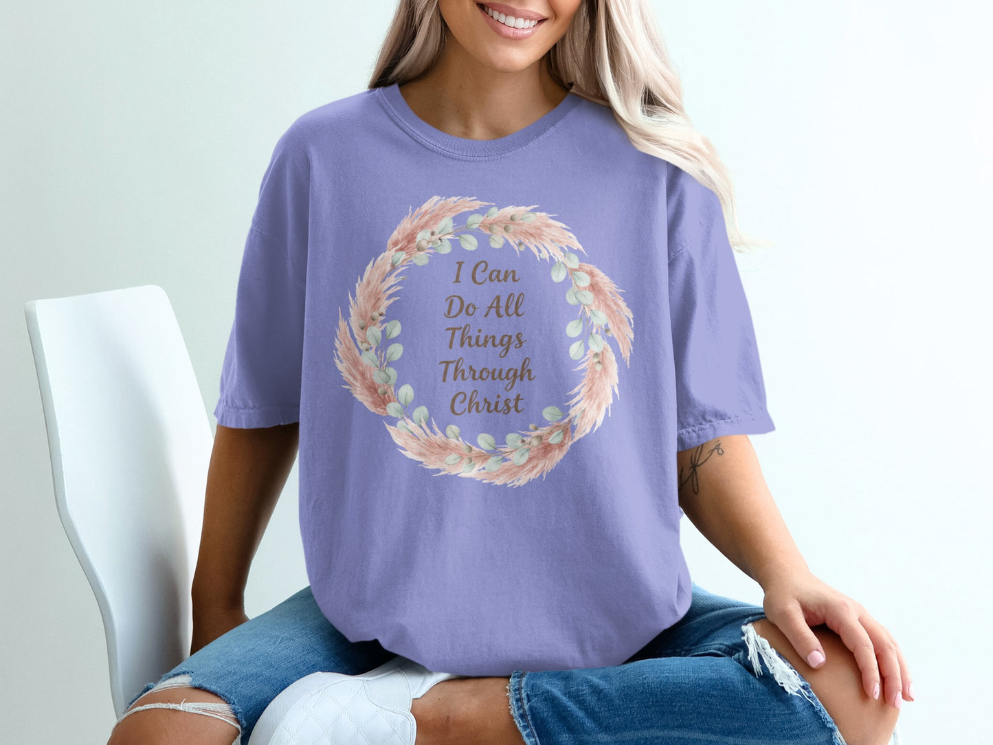Purple t-shirt with floral wreath and text "I Can Do All Things Through Christ".