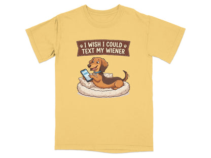 T-shirt with cartoon dachshund texting on a phone in bed.