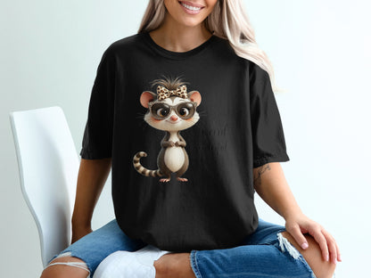 Black t-shirt with cartoon opossum wearing sunglasses and a bow.