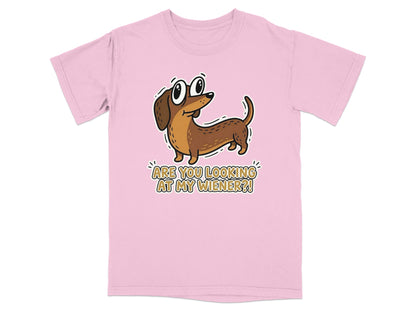 Pink t-shirt with a cartoon wiener dog saying "Are you looking at my wiener?".