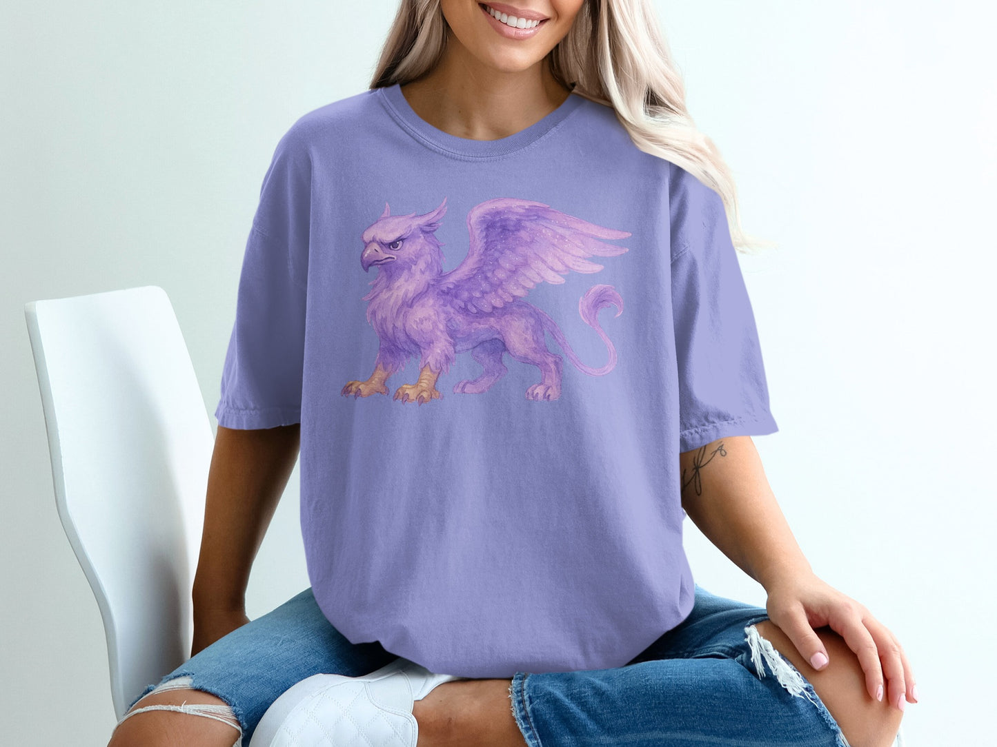 Purple t-shirt with a watercolor griffin graphic.