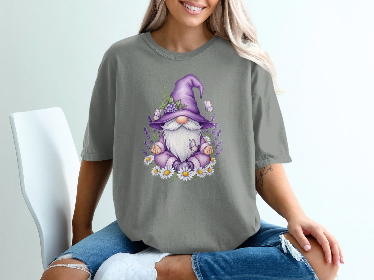 Gnome wearing a purple hat surrounded by daisies and lavender.