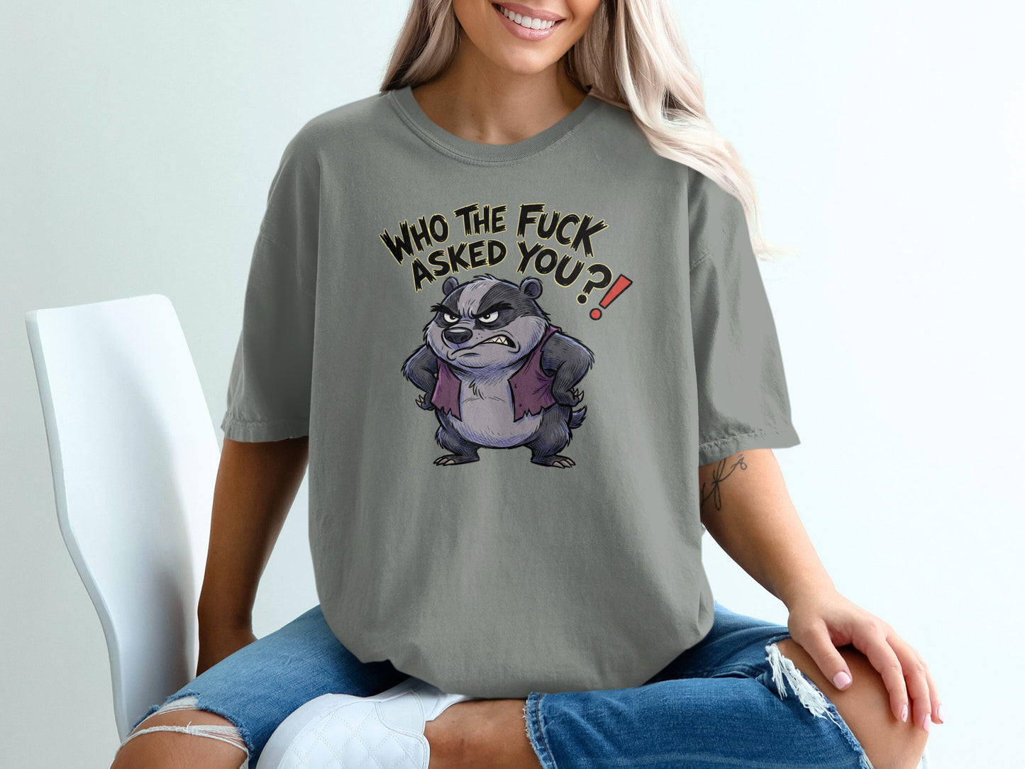 Angry badger with text "WHO THE FUCK ASKED YOU?!" on a grey t-shirt.