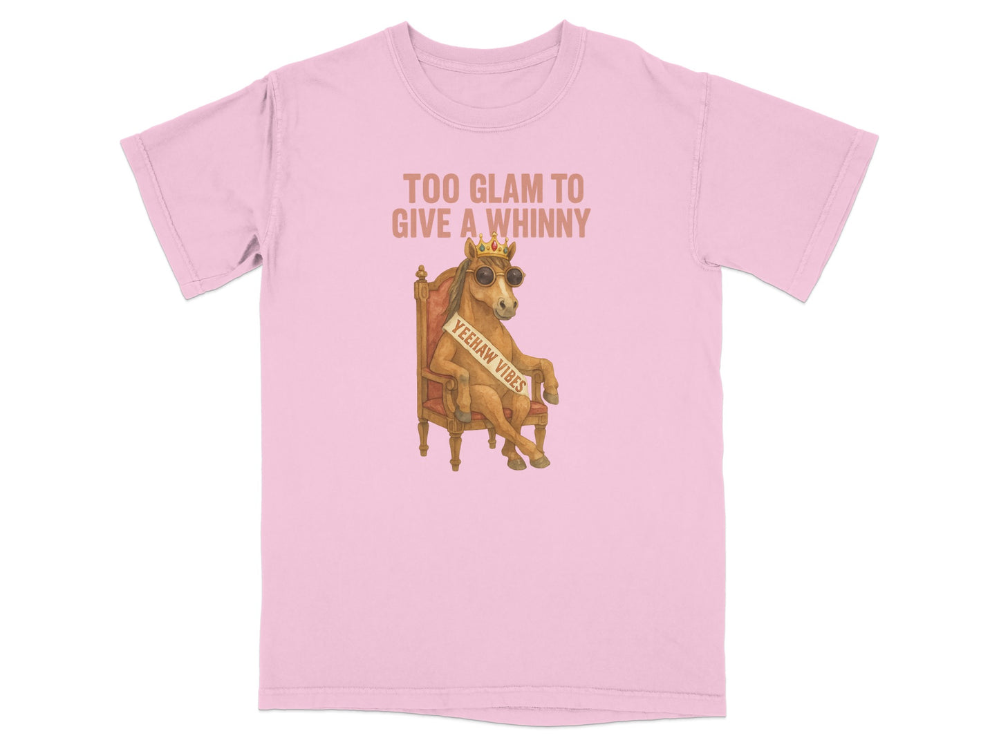 Pink t-shirt with a horse sitting on a throne wearing sunglasses and a sash reading "Yeehaw Vibes."