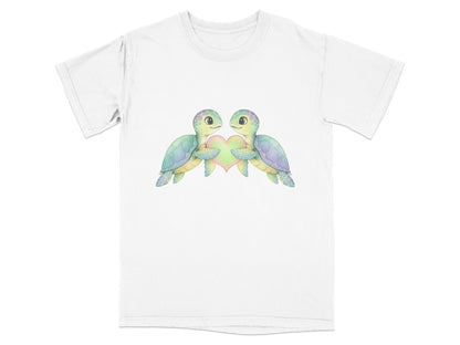 Two watercolor turtles holding a pastel heart design on a white t-shirt.