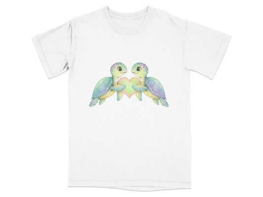 Two watercolor turtles holding a pastel heart design on a white t-shirt.