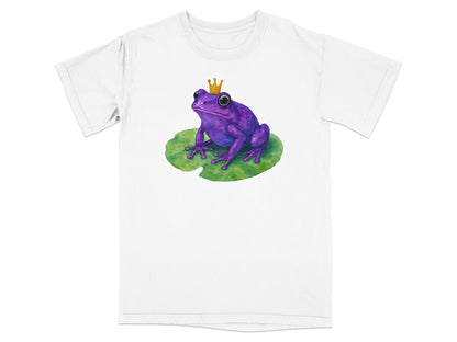 Purple frog with a crown sitting on a lily pad, printed on a white t-shirt.