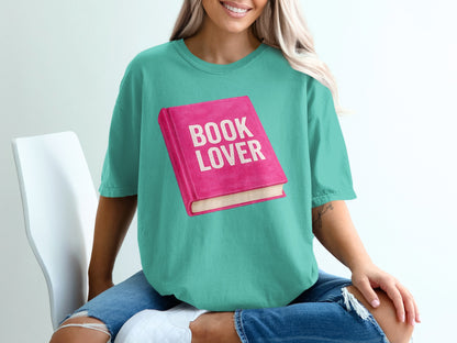 Teal t-shirt with graphic of a pink book that reads "BOOK LOVER".