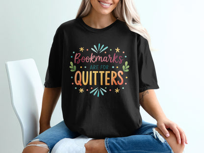 Black t-shirt with "Bookmarks are for quitters" text and colorful graphic.