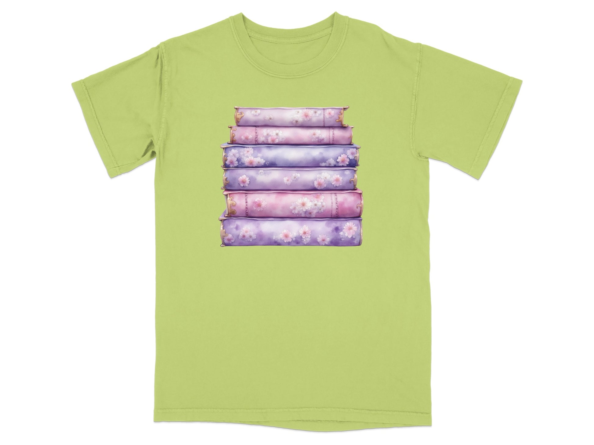 Stack of floral pattern books on a light green t-shirt.