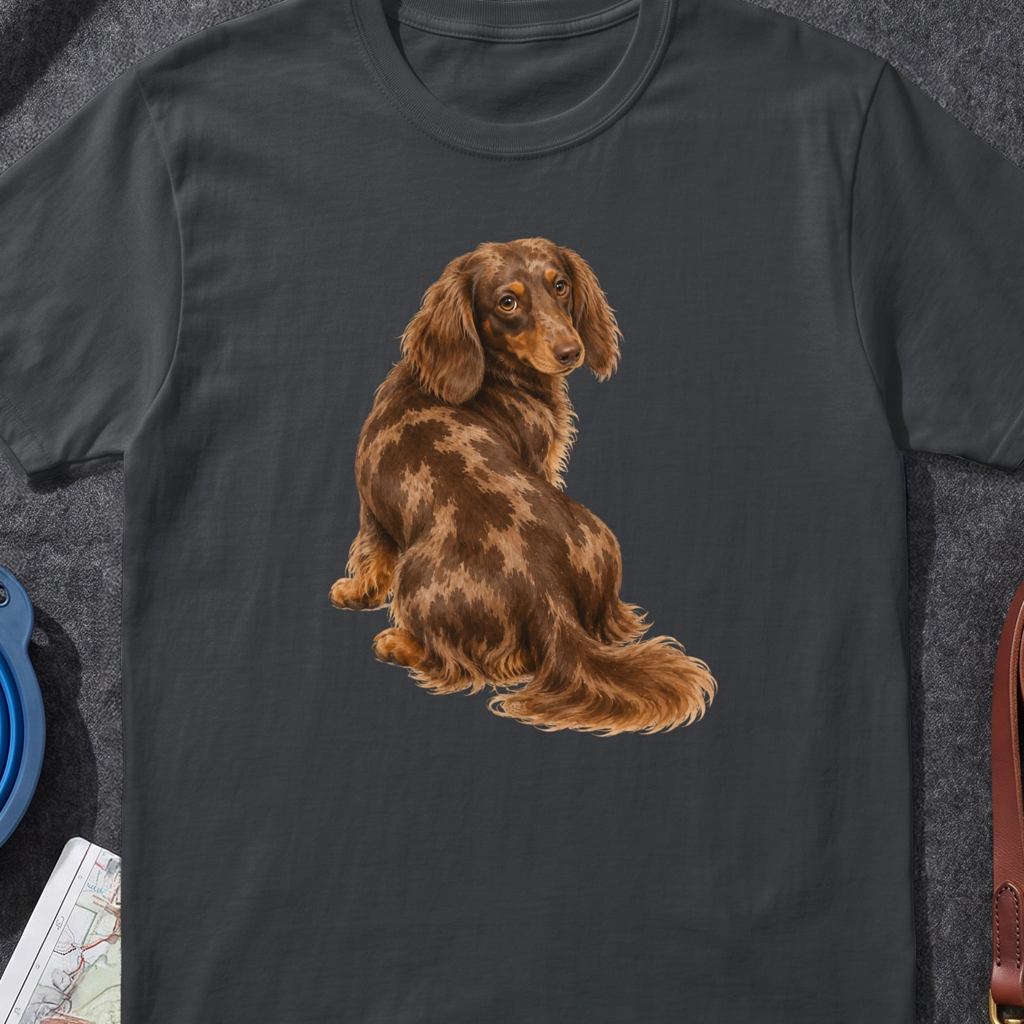 Long-haired dapple dachshund dog illustration on a dark grey t-shirt.