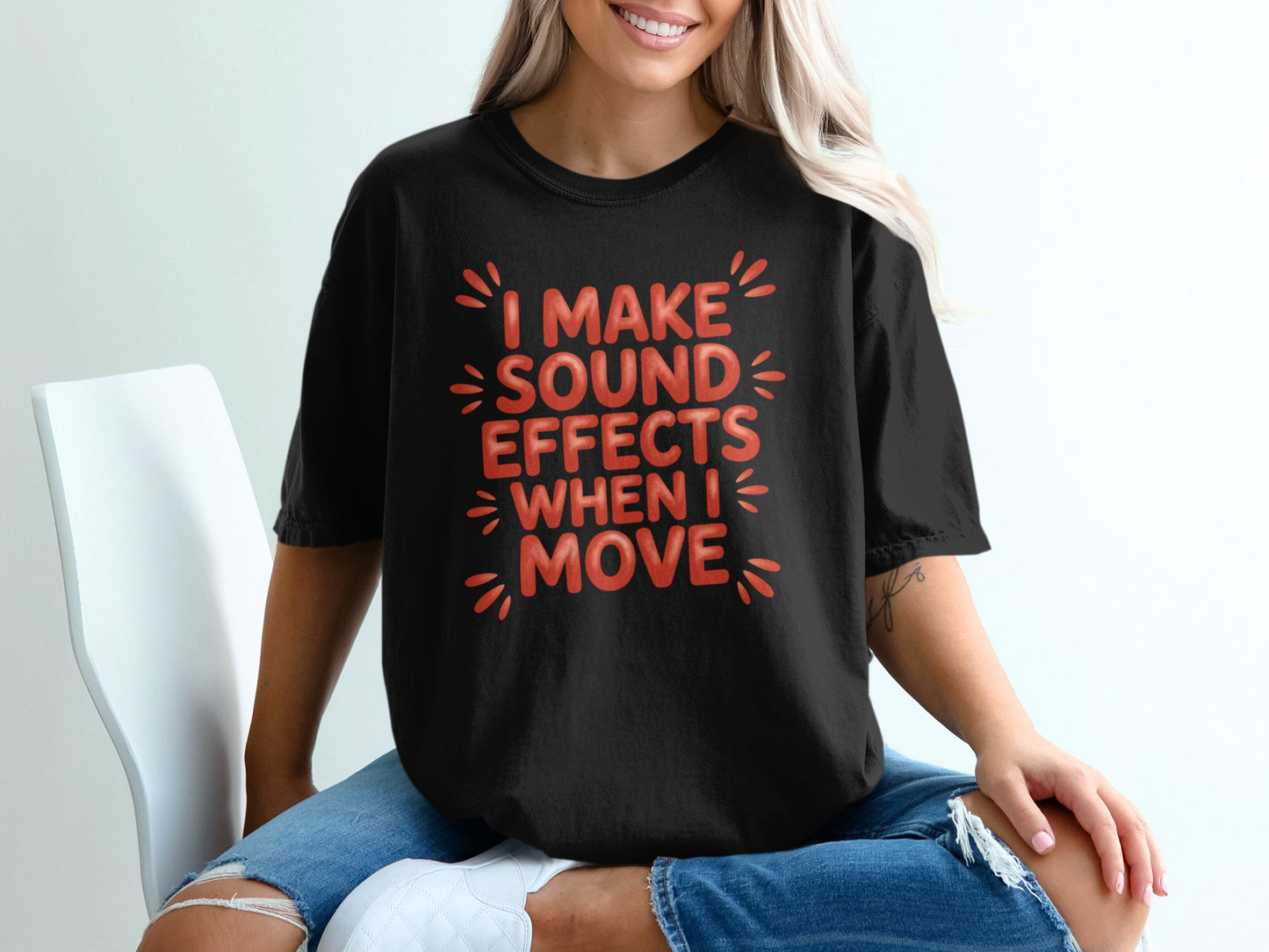 Black t-shirt with "I MAKE SOUND EFFECTS WHEN I MOVE" text in red.