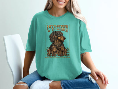 Teal t-shirt with a dachshund and "Life's Better With Wiener Hair" text.