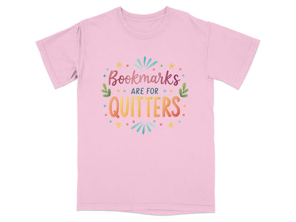 Pink t-shirt with "Bookmarks are for quitters" text in colorful lettering.