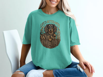 Teal t-shirt with "Life's Better With Wiener Hair" text and dachshund graphic.