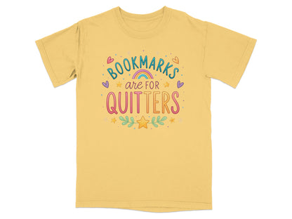 Yellow t-shirt with colorful "Bookmarks are for quitters" text and playful accents.