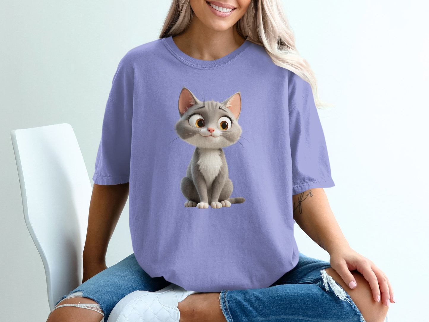 T-shirt with a cartoon cat illustration.