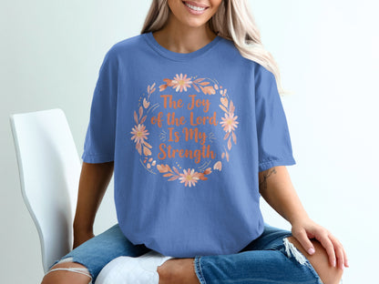 Blue t-shirt with "The Joy of the Lord is My Strength" floral design.