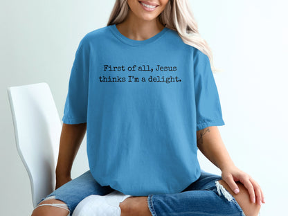 Light blue t-shirt with text "First of all, Jesus thinks I'm a delight."