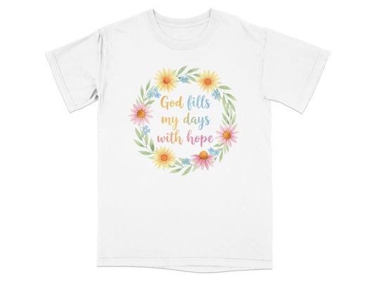 White t-shirt with floral wreath and text "God fills my days with hope".