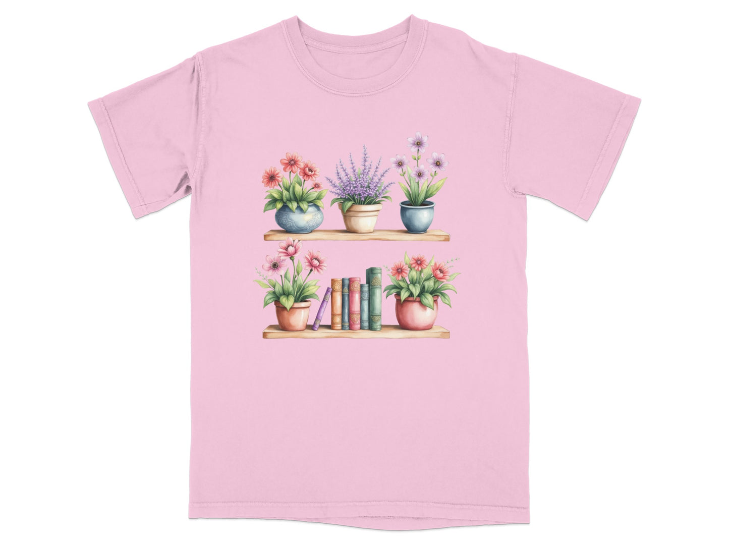 Pink t-shirt with watercolor illustration of flowers and books on two shelves.