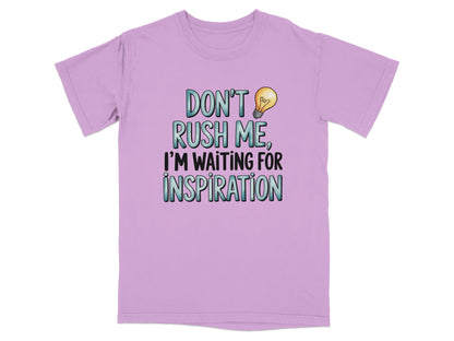 Purple t-shirt with text "Don't rush me, I'm waiting for inspiration."