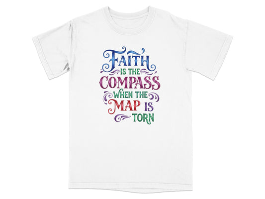 White t-shirt with colorful text: "Faith is the compass when the map is torn."