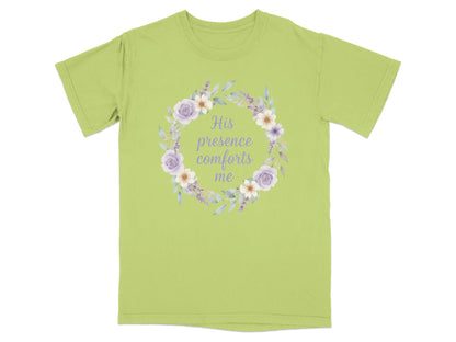 Light green t-shirt with floral wreath and "His presence comforts me" text.
