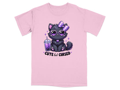 Black kitten with purple heart eyes and bow, holding a drink, "CUTE but CURSED" text.