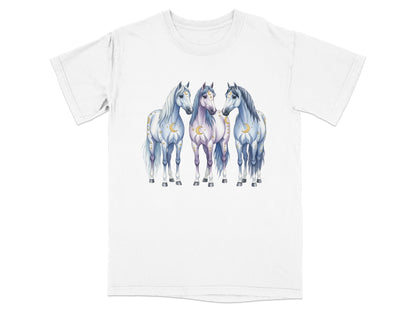 Three stylized white horses with crescent moons and stars on a t-shirt.