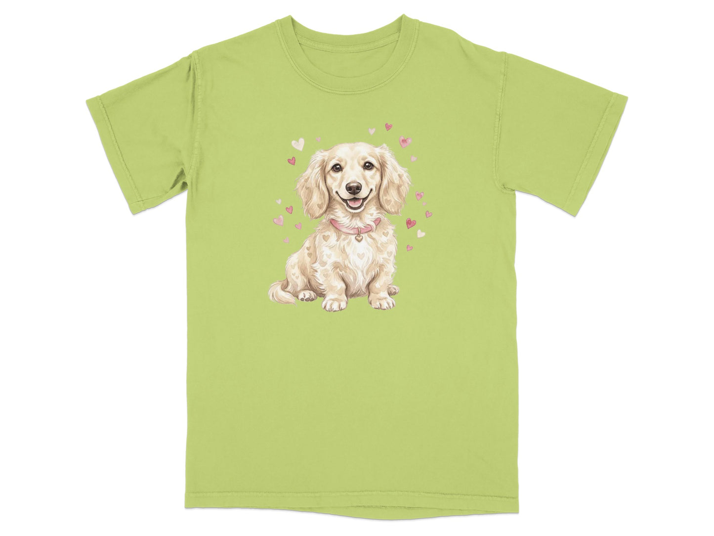 Light green t-shirt with a cartoon dachshund wearing a pink collar surrounded by hearts.