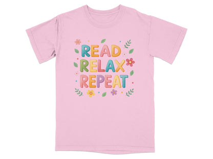 Pink t-shirt with "READ RELAX REPEAT" and floral design.