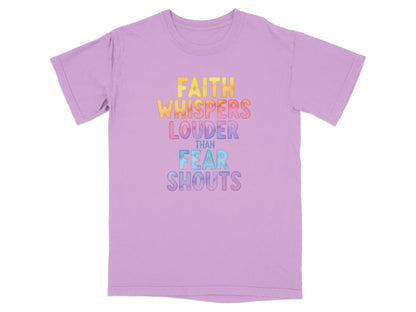 Purple t-shirt with "FAITH WHISPERS LOUDER THAN FEAR SHOUTS" text in colorful gradient.
