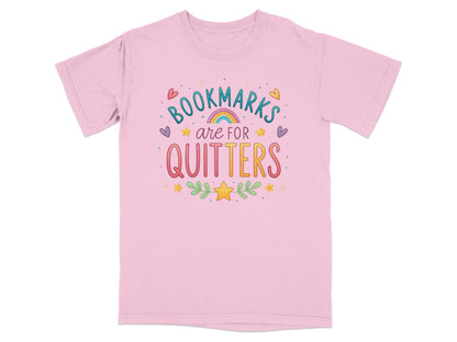 Pink t-shirt with "Bookmarks are for Quitters" text and colorful embellishments.