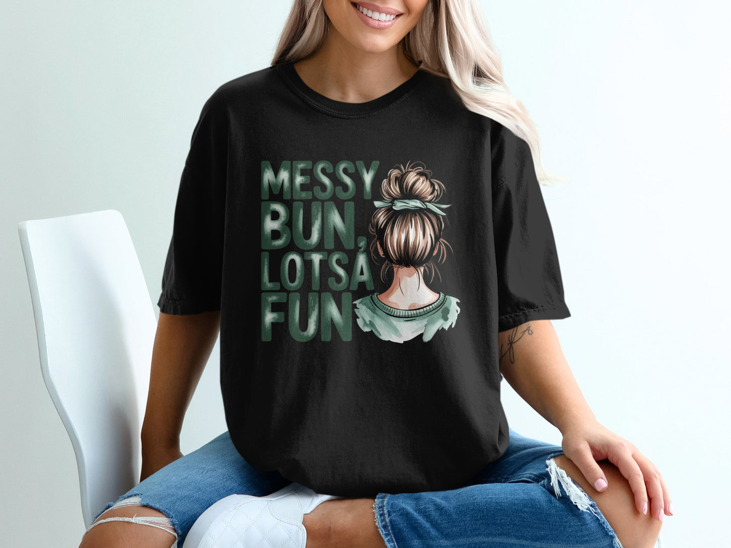 Black t-shirt with "Messy Bun, Lotsa Fun" text and illustration.