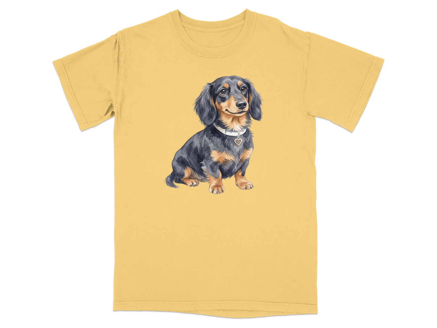 Dachshund dog wearing a heart-shaped tag on a yellow t-shirt.