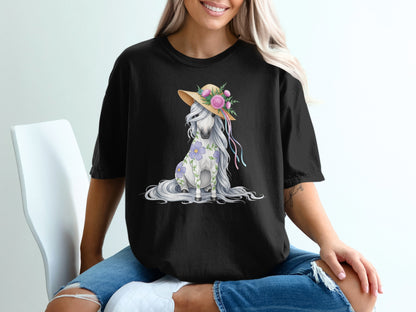 Black t-shirt with a seated white horse wearing a straw hat and flowers.