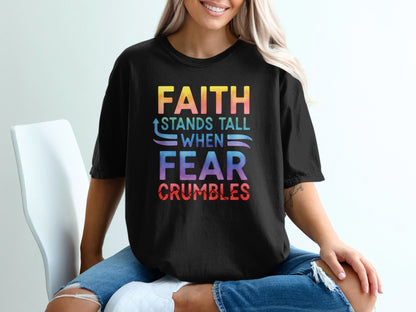 Black t-shirt with colorful text: "FAITH STANDS TALL WHEN FEAR CRUMBLES".