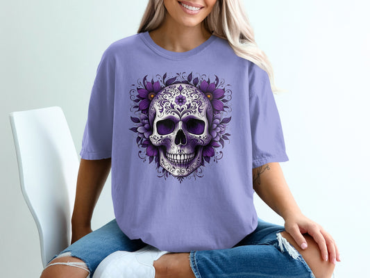 Purple t-shirt with a detailed floral skull graphic on the front.