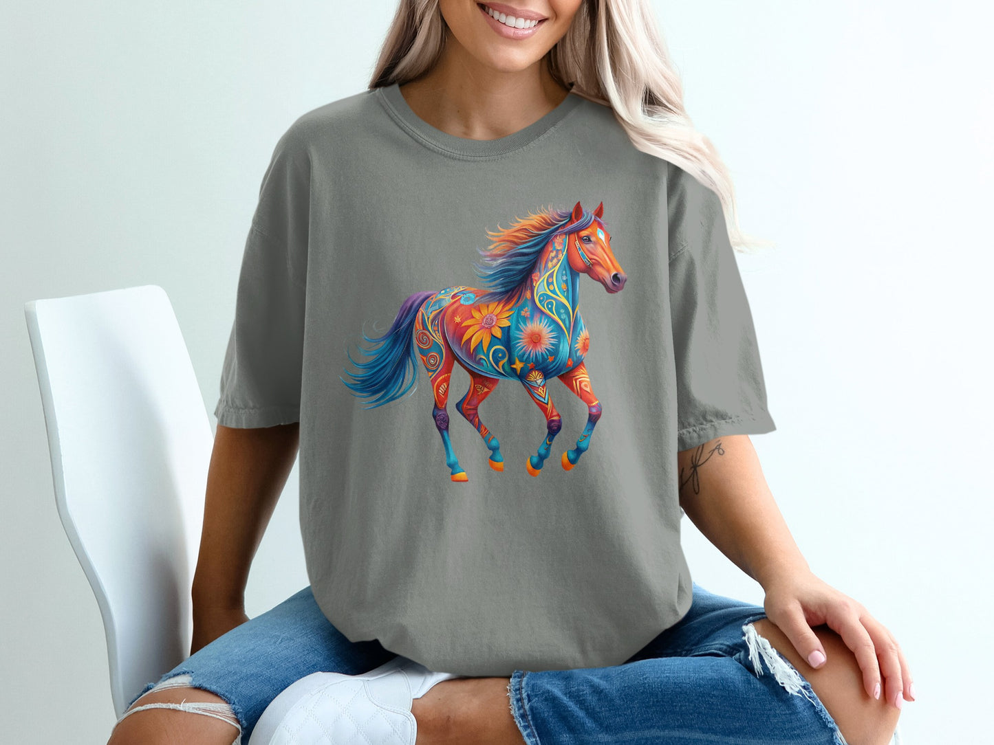 Colorful, ornate horse graphic design on a gray t-shirt.