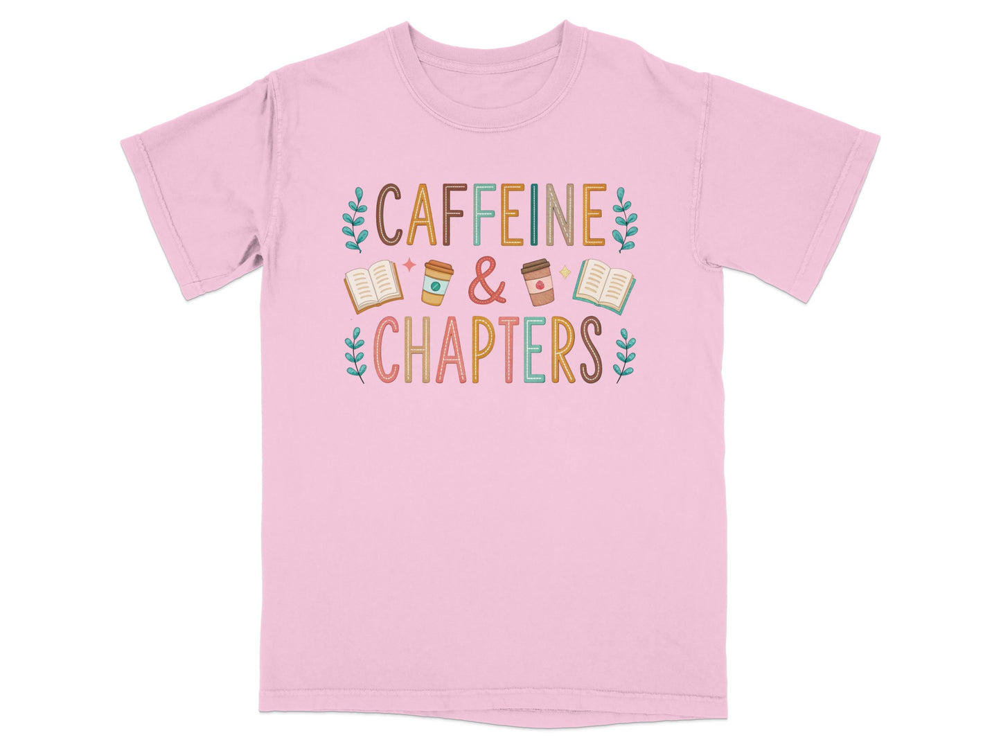 Pink t-shirt with "Caffeine & Chapters" text and decorative elements.