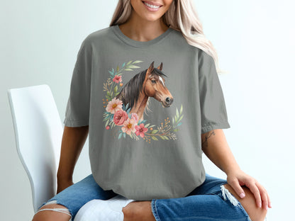 Horse head illustration with floral wreath on gray t-shirt.