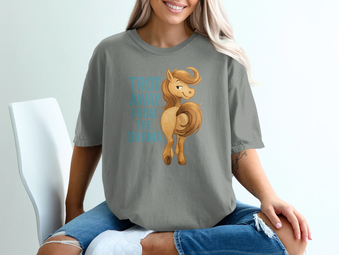 Gray t-shirt with a cartoon horse and text "TROTT AWAY FROM THE DRAMA".
