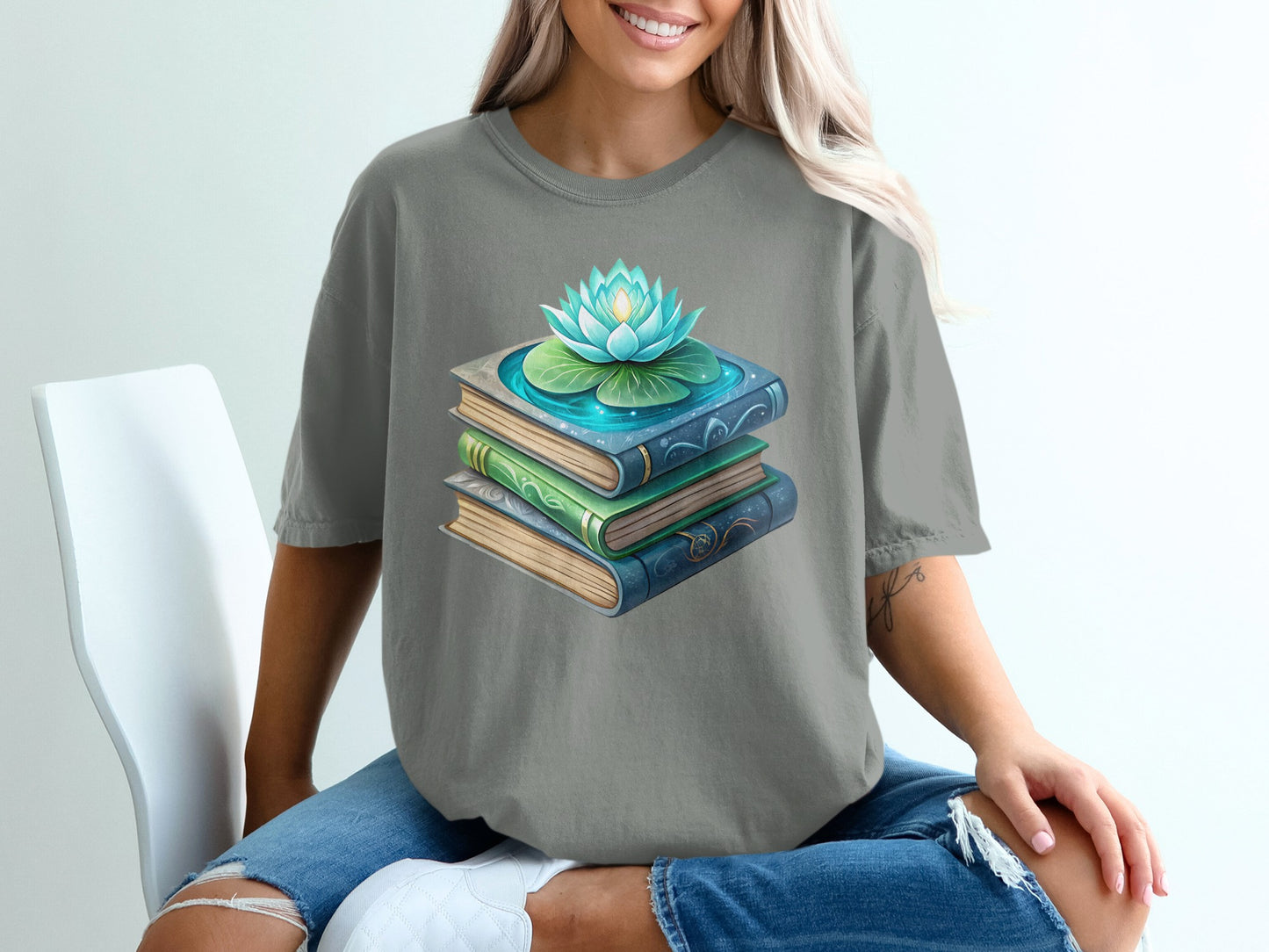 Stack of books with a lotus flower floating on top.